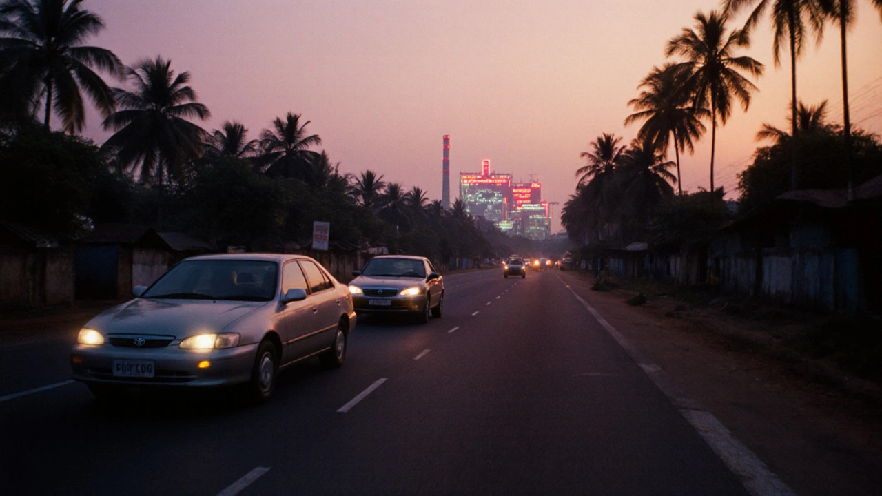 Toyota Corolla and Camry driving on an Indian highway at sunset near a factory.